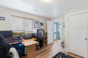 Office with light wood-type flooring