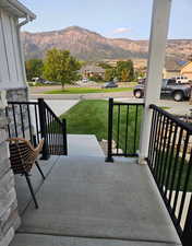 Porch featuring a mountain view