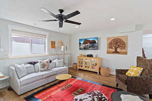 Living area with wood finished floors, recessed lighting, and ceiling fan
