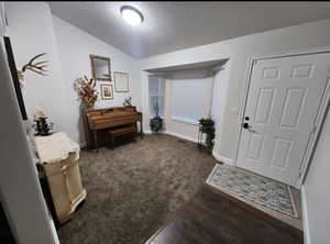 Entry way with carpet and LVP flooring