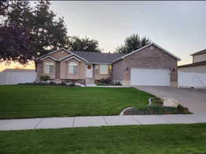 Rambler with two car garage that's extra wide and extra tall, fully fenced yard