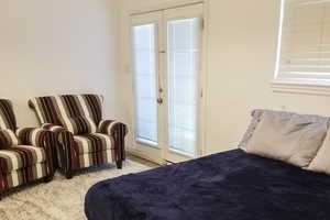 Bedroom with access to exterior and french doors