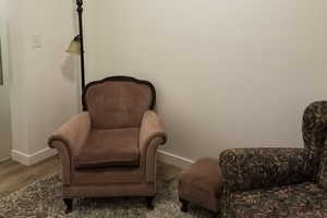 Living area featuring wood finished floors and baseboards