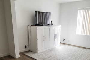 Detailed view of wood finished floors and baseboards