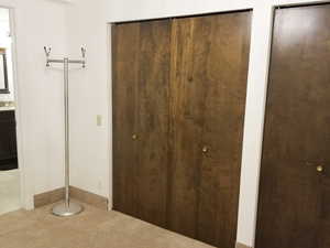 Unfurnished bedroom featuring two closets and carpet flooring