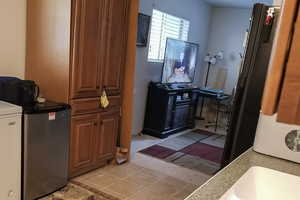 Bathroom featuring light tile patterned floors and a sink