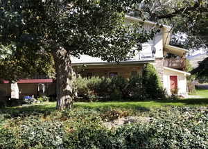 View of front of house featuring a balcony
