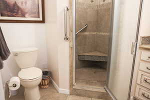ADU - Bathroom with a stall shower, tile flooring, and vanity