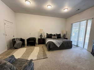 ADU - Master Bedroom with carpet flooring and access to the outside