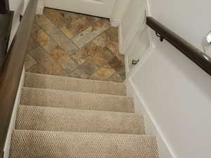 Stairway with stone finish floors