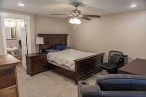 Bedroom featuring recessed lighting, a ceiling fan, and ensuite bathroom