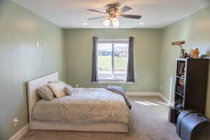 Bedroom featuring carpet floors and ceiling fan