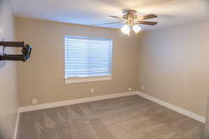 Basement apartment Master bedroom featuring carpet and ceiling fan