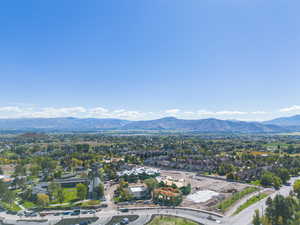 Aerial perspective of suburban area featuring a mountain backdrop