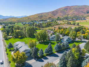 Aerial perspective of suburban area featuring a mountain backdrop