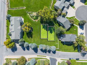 Aerial perspective of suburban area featuring property parcel outlined