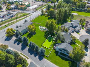 Aerial perspective of suburban area featuring property boundaries highlighted