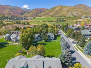 Aerial perspective of suburban area with a mountain backdrop