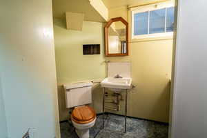 Half bath with toilet and a sink