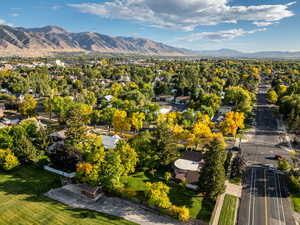 Aerial perspective of suburban area with a mountainous background