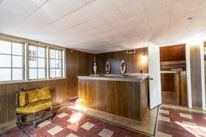 Welcome area with wood walls