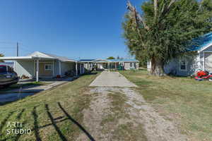 Ranch-style house with a front yard and driveway