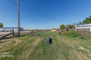View of yard with a rural view