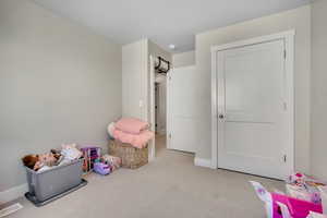 Playroom featuring carpet and baseboards