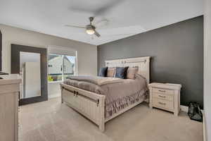 Bedroom with light carpet and ceiling fan