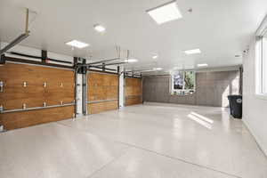 View of 3 car garage with Car Charging Station