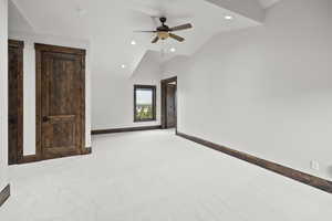 Room for games or TV with carpet, a ceiling fan, recessed lighting, and high vaulted ceiling. Laundry Closet behind the door for a stackable Washer and dryer.