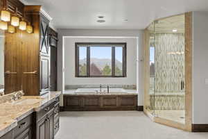 Bathroom featuring a steam shower stall, a garden tub, vanity, a mountain view, and light carpet
