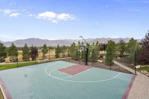 View of sport court featuring a mountain view a basketball court