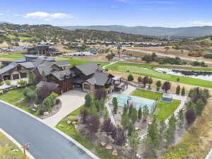 Aerial perspective featuring  the Golf Course, pond and mountain views.