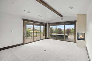 MASTER Bedroom featuring HUGE SLIDER Windows with amazing views of Mt Timpanogos, Gas Fireplace, carpet, recessed lighting, and a mountain/valley  views