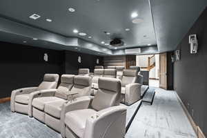 Carpeted cinema room featuring CUSTOM Luxury recliners, Amazing sound system, recessed lighting, a raised ceiling, and a wall mounted AC