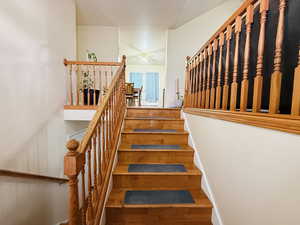 Stairway with wood finished floors