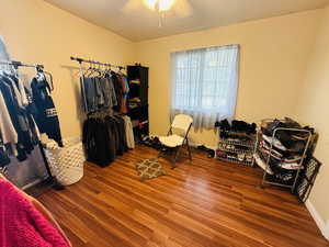 Walk in closet featuring wood finished floors