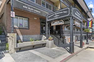View of exterior entry with brick siding