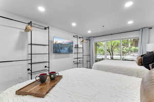 Bedroom with recessed lighting and access to outside