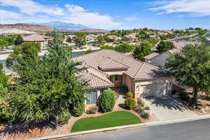 Aerial perspective of suburban area featuring a mountain backdrop