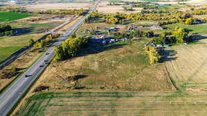 Aerial overview of property's location with rural landscape and large plots for crops