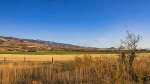 View of mountain backdrop with rural landscape