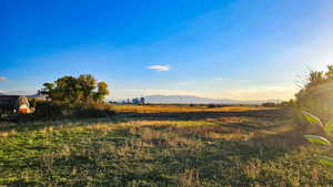 View of yard with a mountain view and a rural view
