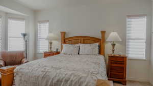 Carpeted bedroom featuring baseboards