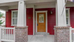 Property entrance with covered porch