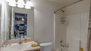 Full bathroom featuring washtub / shower combination and vanity