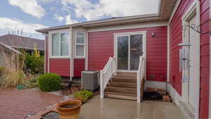 Property entrance with a patio