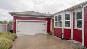 Garage featuring concrete driveway