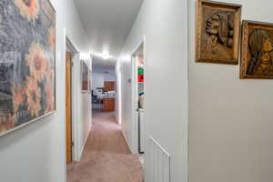 Hall with light colored carpet